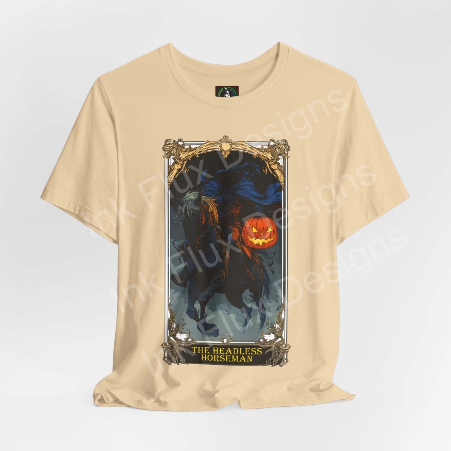 Unisex beige T-shirt featuring a graphic of The Headless Horseman with a glowing pumpkin, perfect for Halloween.