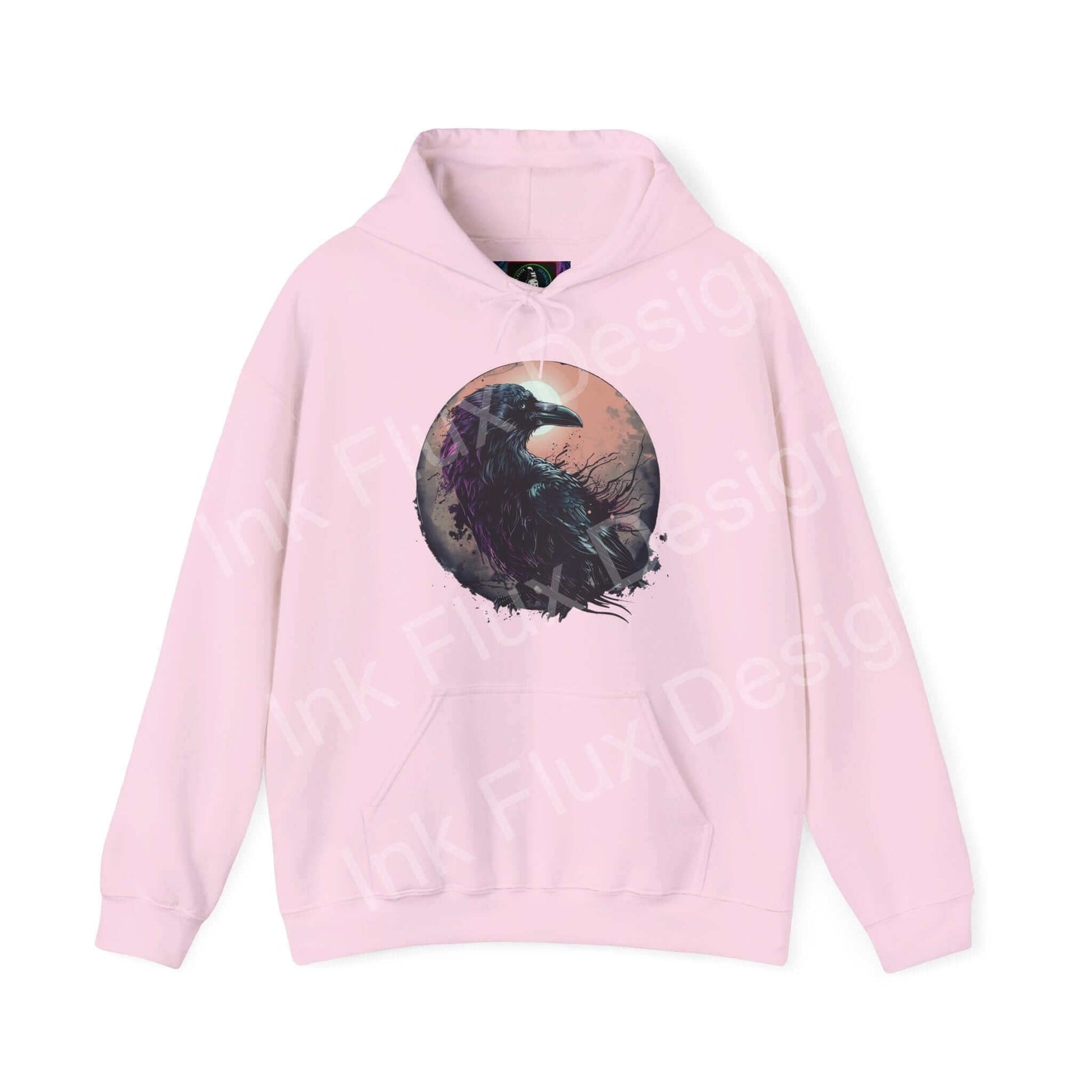 Pink 'The Raven' graphic hoodie featuring a bold raven design in a circular frame on high-quality cotton-polyester blend fabric.