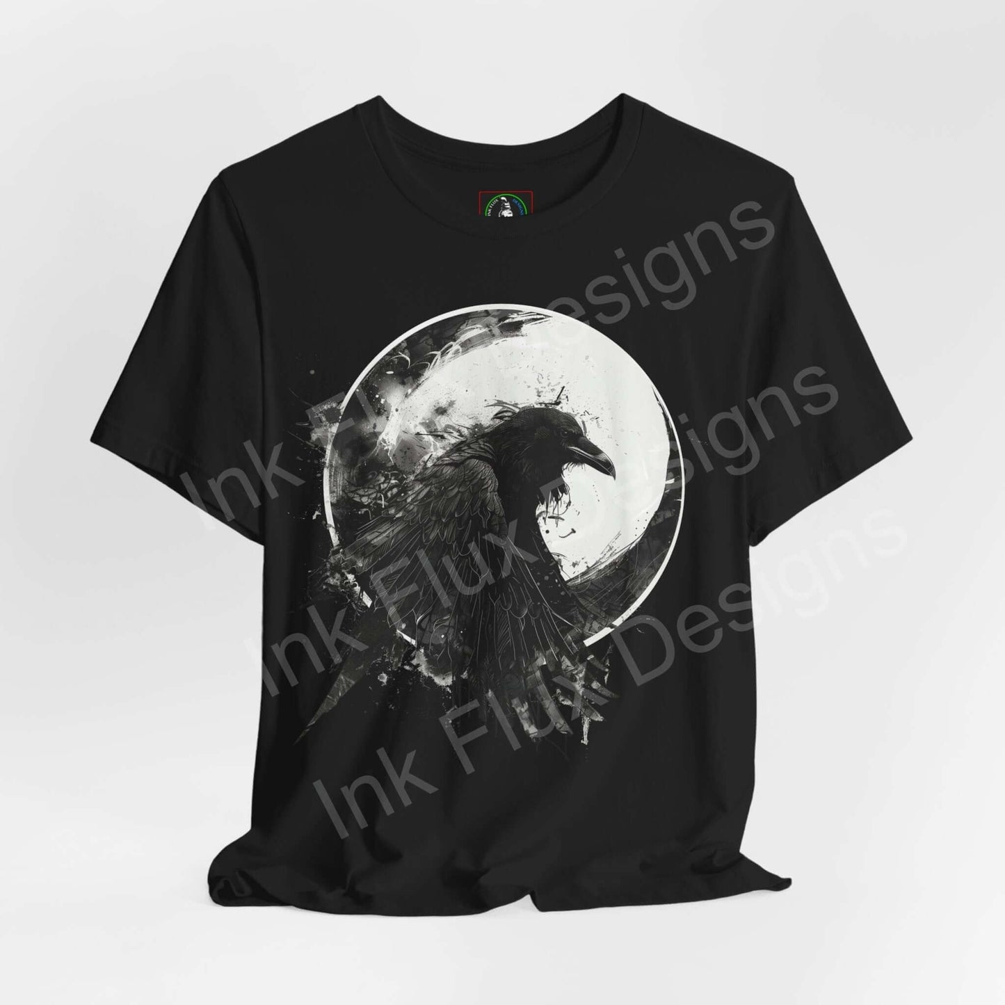 Black "The Raven II" graphic tee showcasing a detailed raven design within a moon, exemplifying a spirit animal motif on breathable Airlume cotton fabric.
