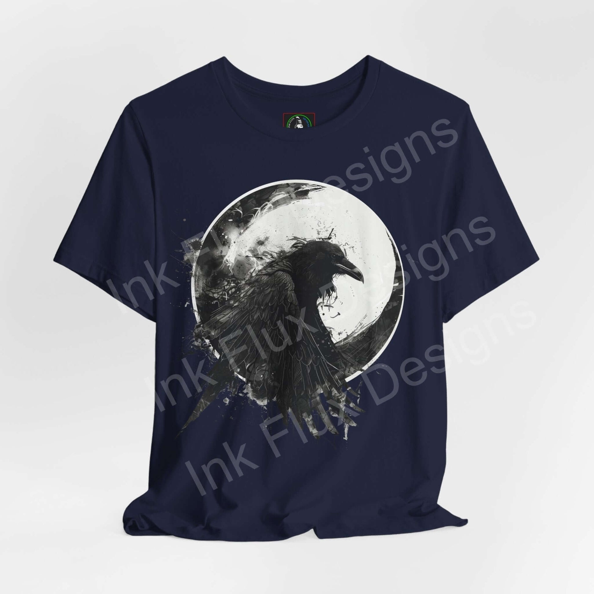Navy blue unisex T-shirt featuring a graphic design of a raven against a moon, from the 'The Raven II' collection by Bella+Canvas.