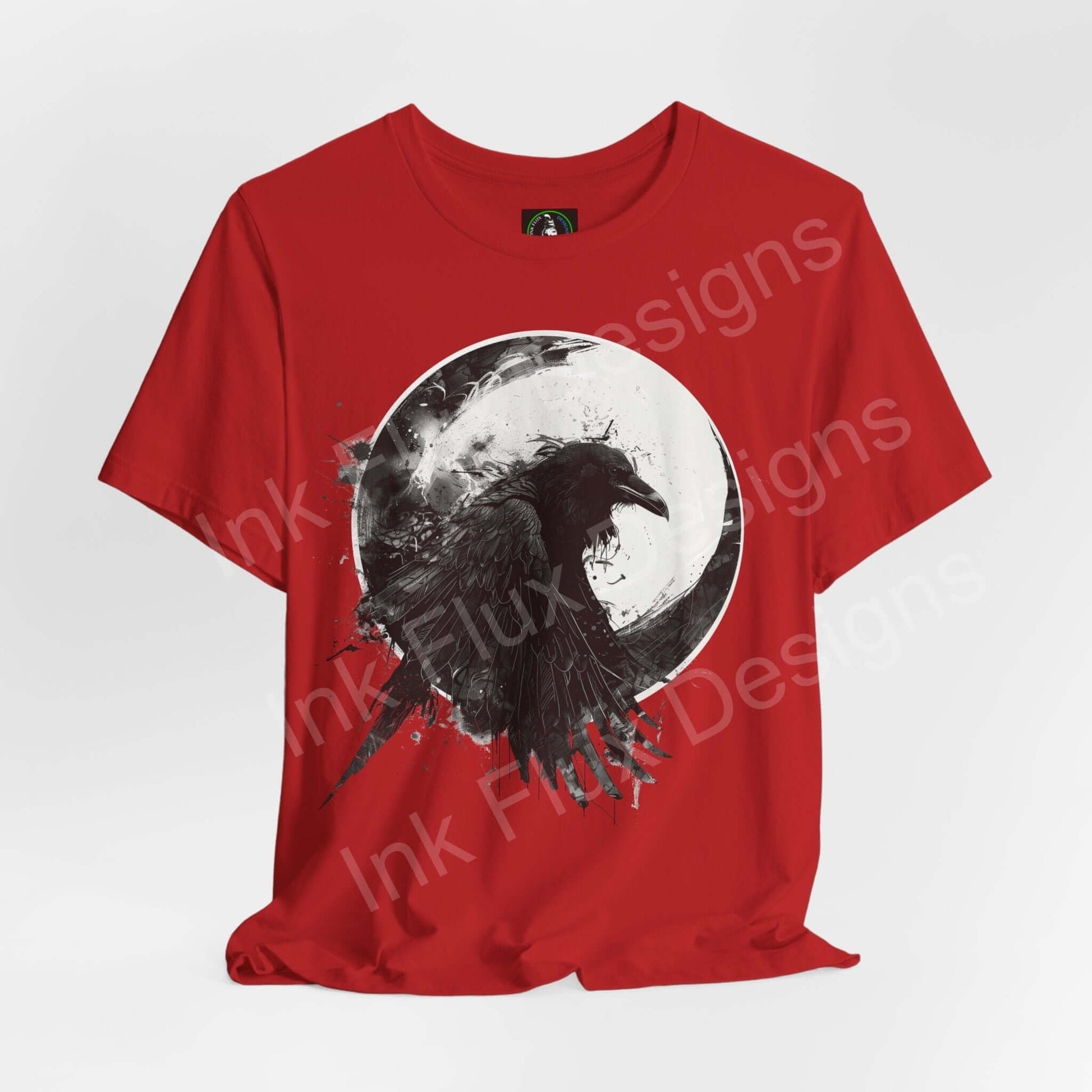 Red unisex jersey T-shirt featuring a graphic of a raven against a moon, exemplifying spirit animals, ideal for style and comfort.