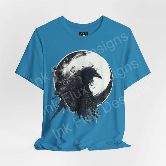 Unisex blue T-shirt featuring a graphic of a raven against a moon, part of the 'Spirit Animals' collection by Bella+Canvas