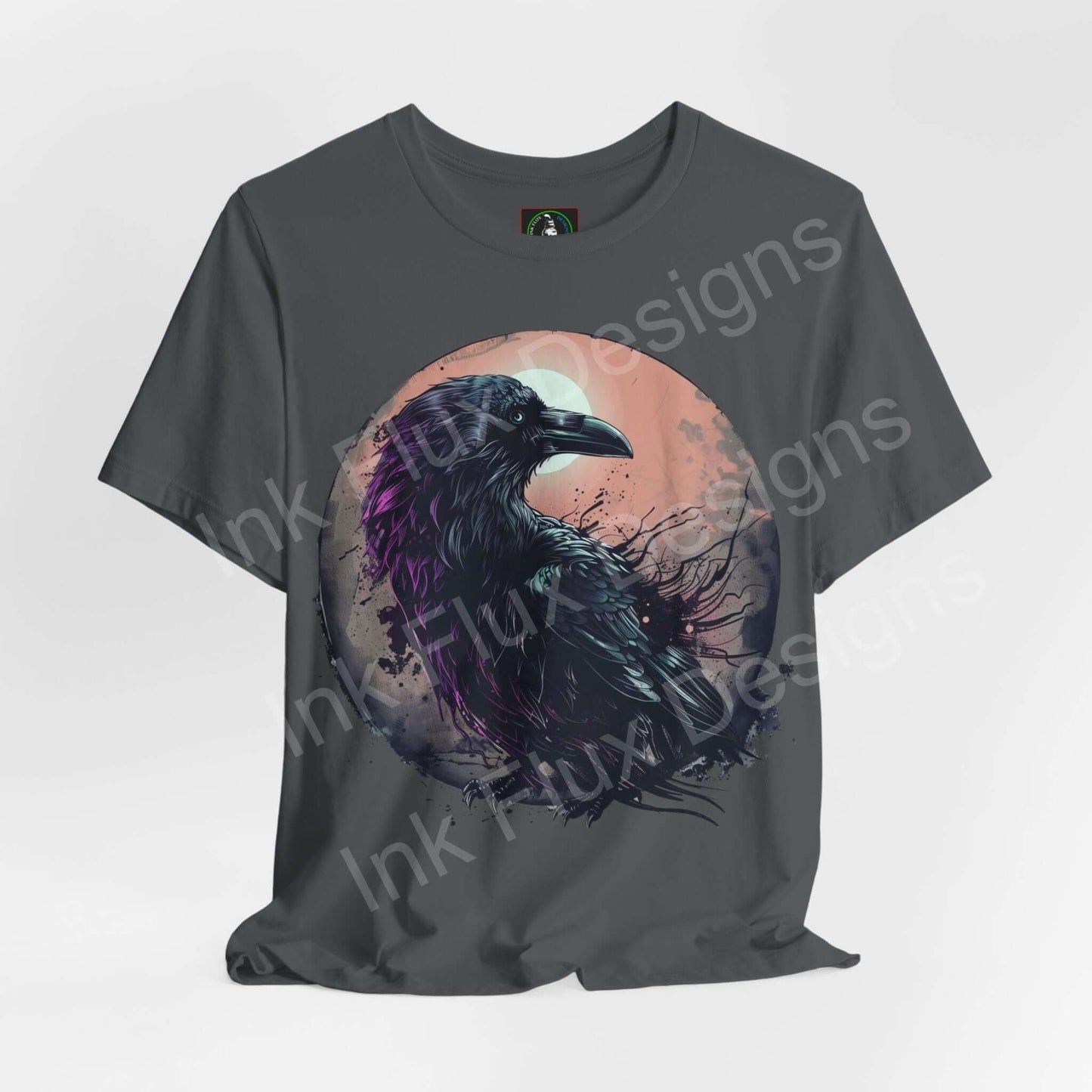 Graphic tee featuring a vibrant raven design on a gray shirt, embodying spirit animals and style, perfect for T-shirt enthusiasts.