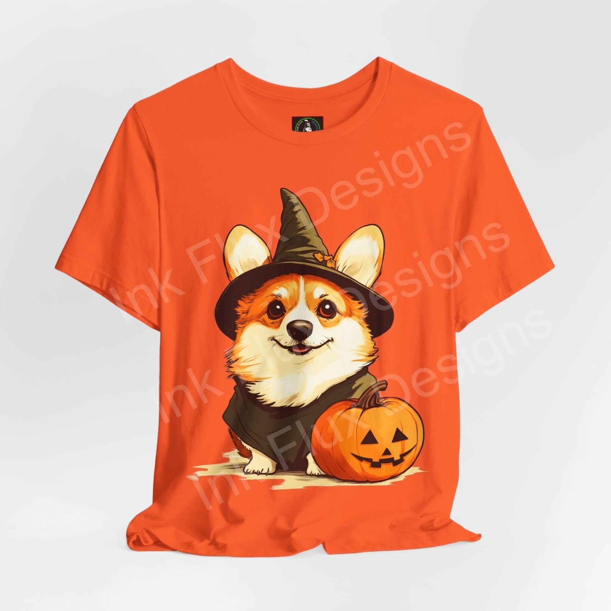 Halloween-themed orange T-shirt featuring a cute Corgi in a witch hat beside a pumpkin, ideal for graphic tee enthusiasts.