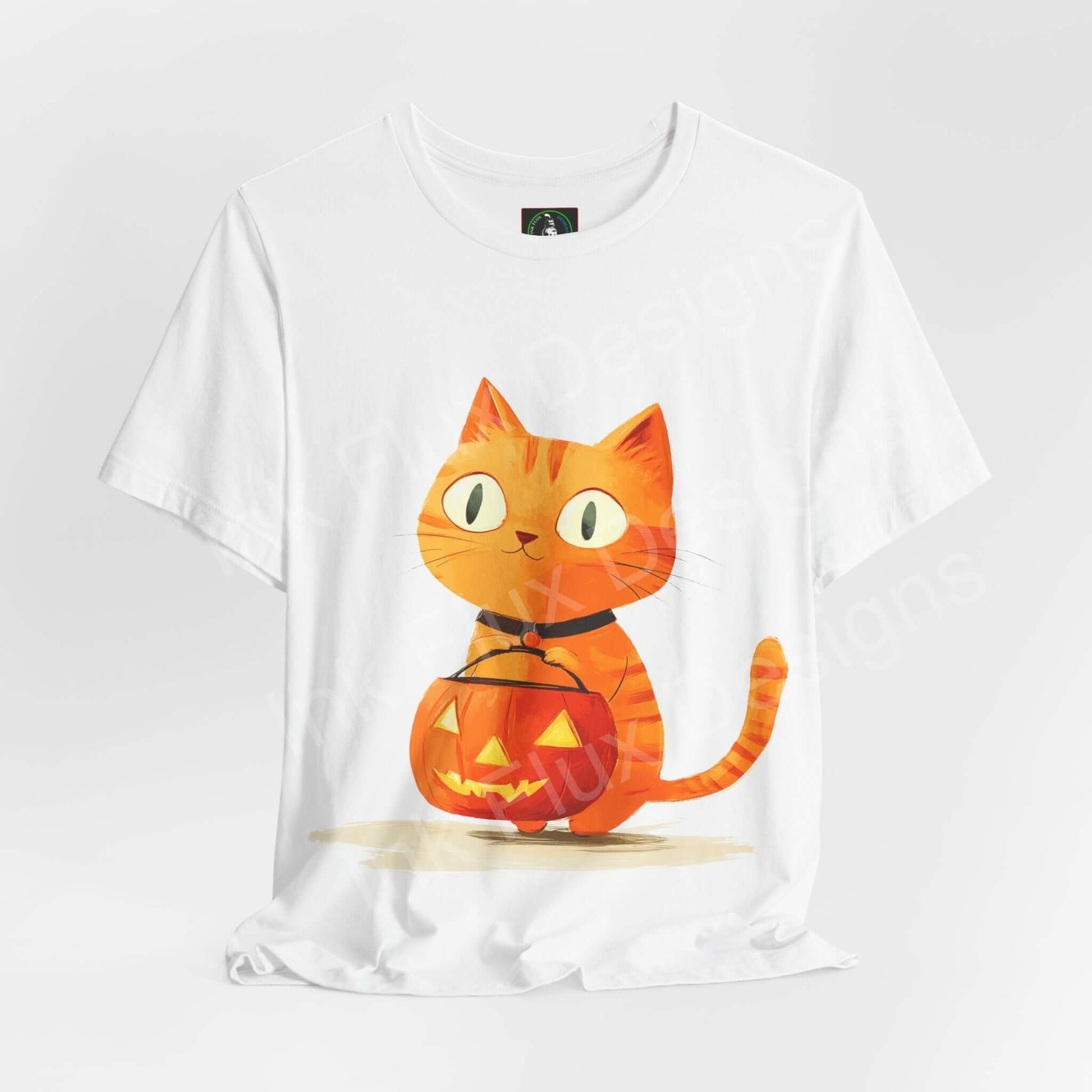 Unisex white T-shirt featuring a graphic of an orange cat with a Halloween pumpkin, crafted from breathable Airlume cotton by Bella+Canvas.