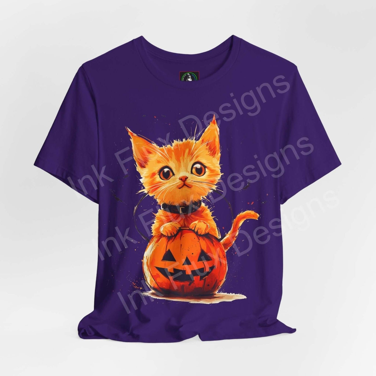 Halloween-themed graphic tee featuring an orange cat sitting in a jack-o'-lantern on a purple shirt, ideal for Halloween.