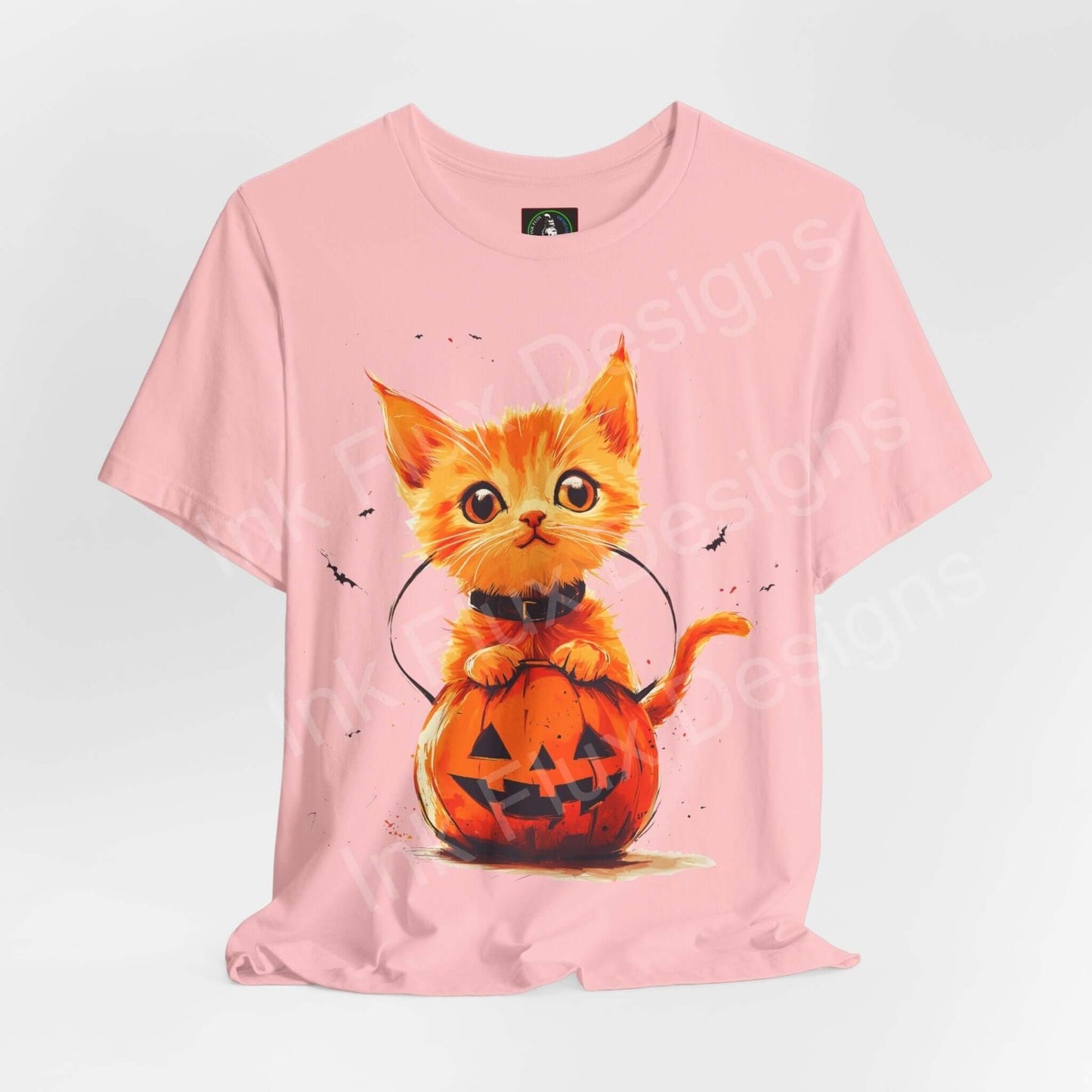 Pink Trick o Treat Orange Cat graphic tee featuring a cute kitten in a pumpkin for Halloween.