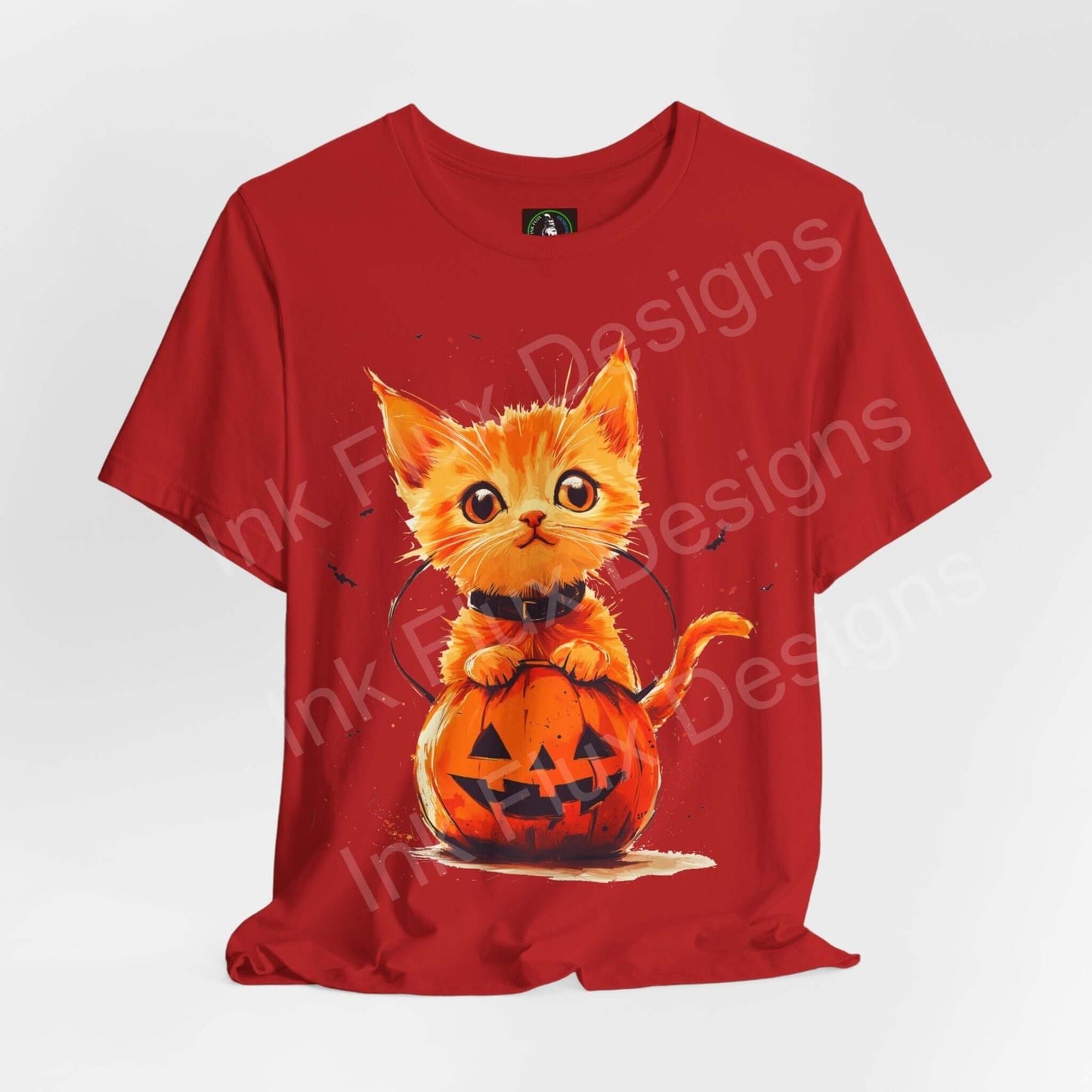 Red Halloween T-shirt featuring an orange cat popping out of a jack-o'-lantern, ideal for holiday graphic tees.