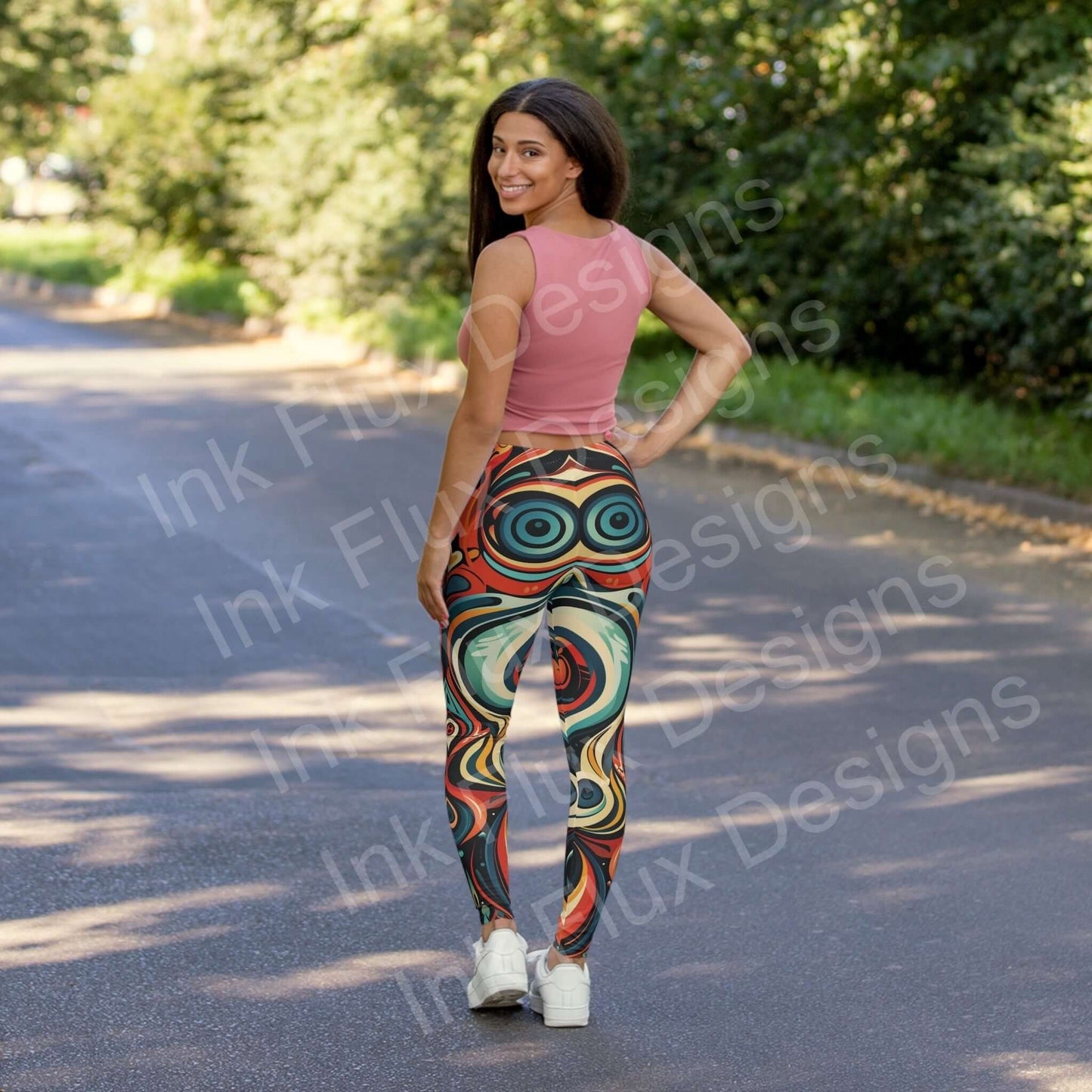 Woman smiling on a sunny road wearing Trippy Leggings II with bold, psychedelic patterns in a skinny fit, polyester-spandex blend.