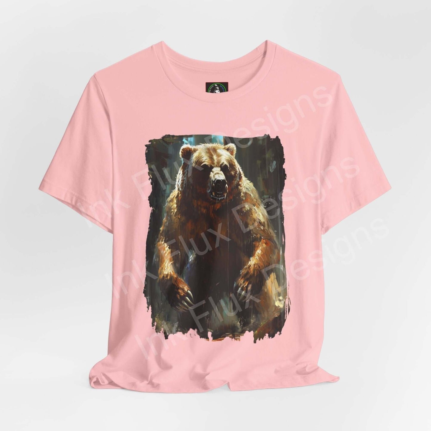 Pink unisex T-shirt featuring a graphic print of a roaring Kodiak bear, ideal for fans of spirit animals and ethically made graphic tees.