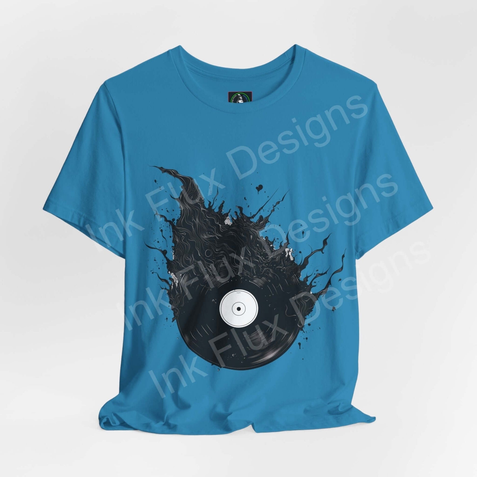 Blue unisex jersey T-shirt with bold vinyl record graphic design, ethically made by Bella+Canvas, ideal for style and comfort.