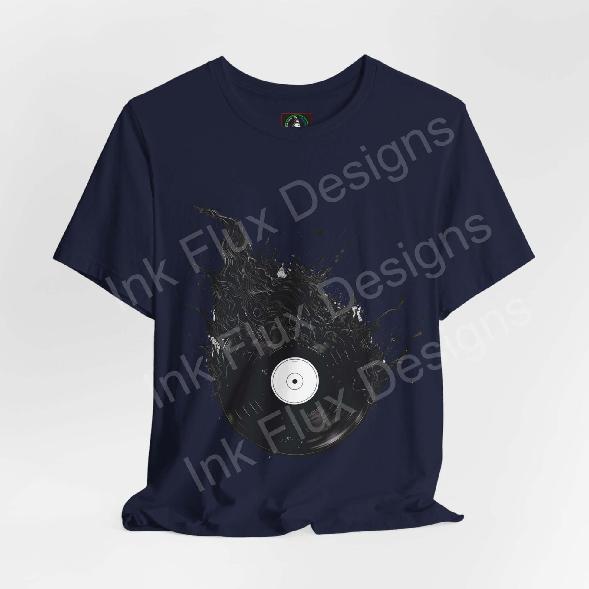 Navy blue unisex T-shirt featuring a bold graphic of a vinyl record in a splatter design, from Bella+Canvas, showcasing style and sustainability.