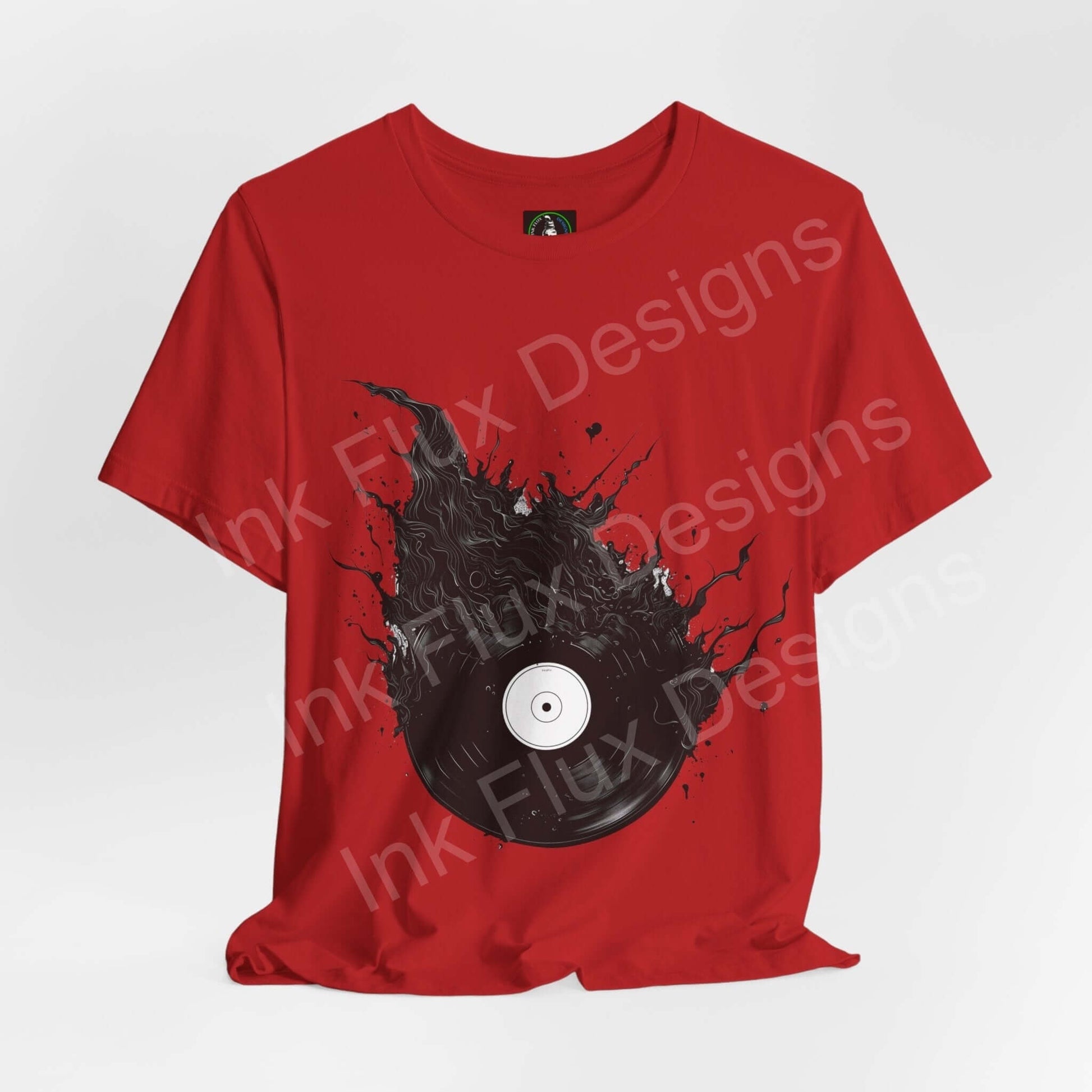Red unisex T-shirt with bold graphic of a vinyl record in a splash design, comfortable and stylish, by Bella+Canvas.