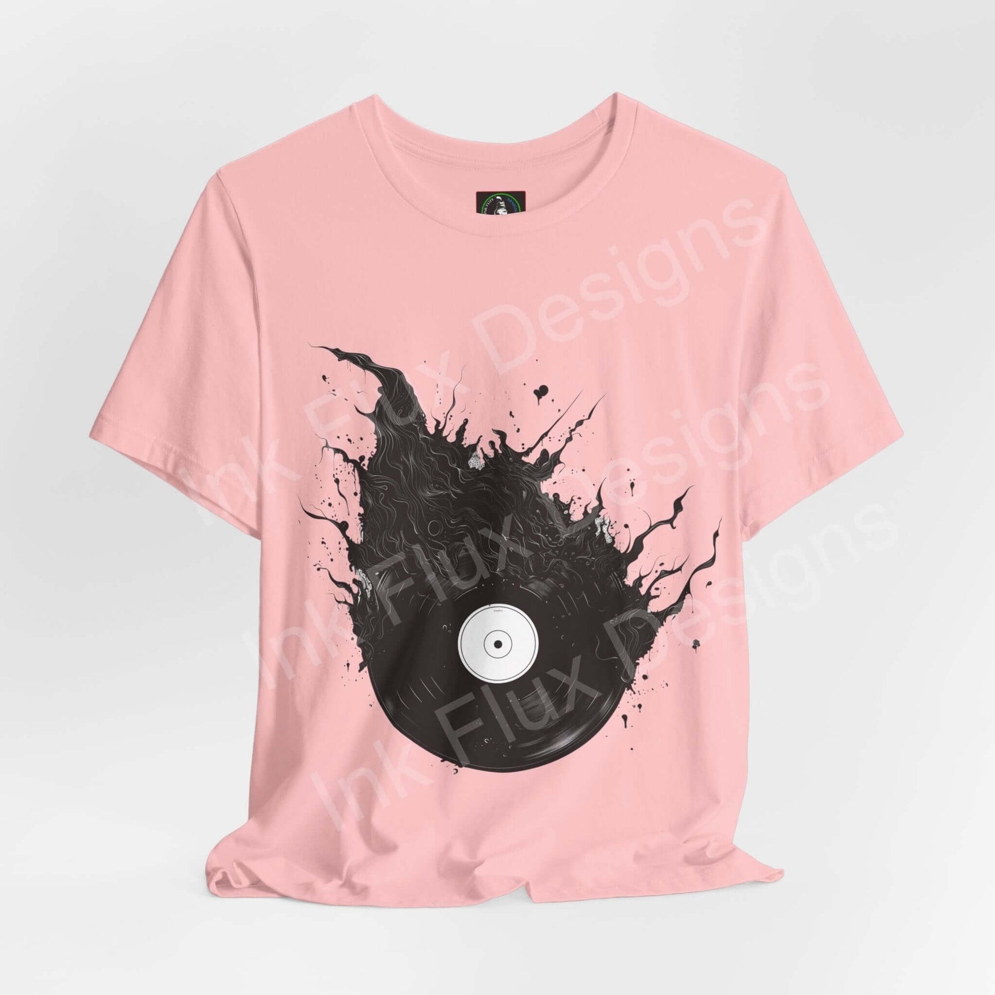 Pink unisex T-shirt with bold vinyl record graphic, Bella+Canvas, comfortable and stylish, ideal for any occasion.