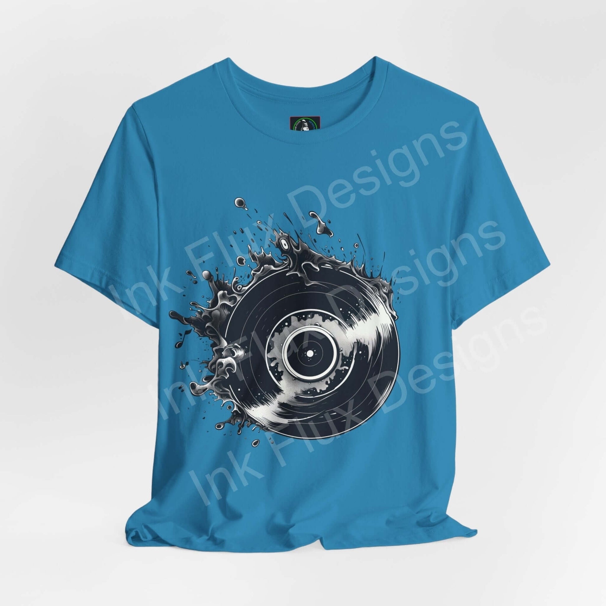 Unisex blue T-shirt with a bold graphic of a vinyl record and ink splatter design, emphasizing modern style and comfort