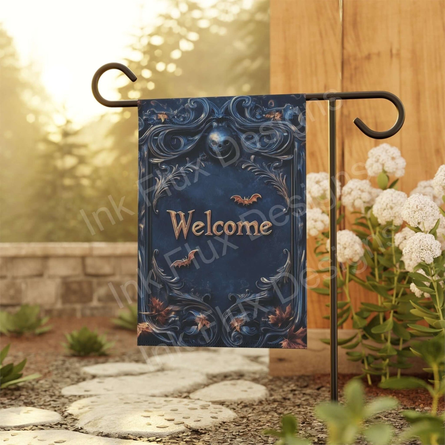 "Welcome II Banner featuring Halloween-inspired design, hung in a garden setting on a sunny day, surrounded by white flowers."