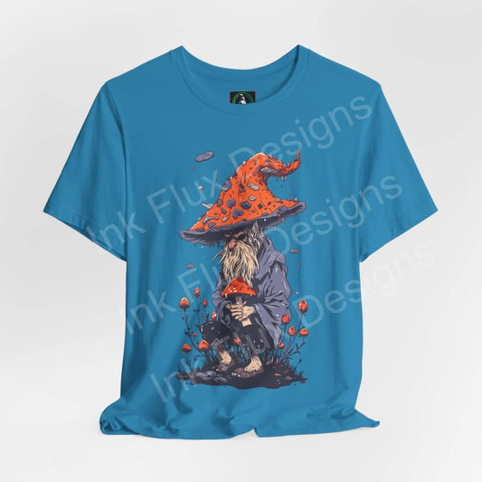 Blue unisex Wise Wizard II T-shirt featuring a trippy, psychedelic graphic of a wizard with a large red mushroom hat, crafted by Bella+Canvas.