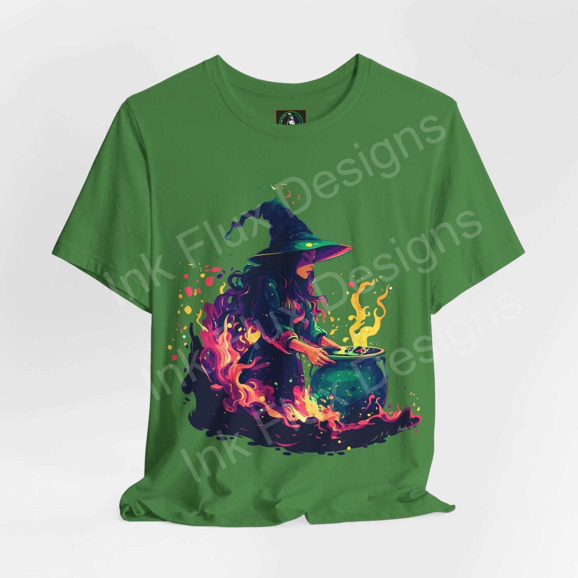 Green "Witches Brew" graphic tee featuring a vibrant design of a witch concocting a potion, perfect for Halloween and styled for unisex wear.