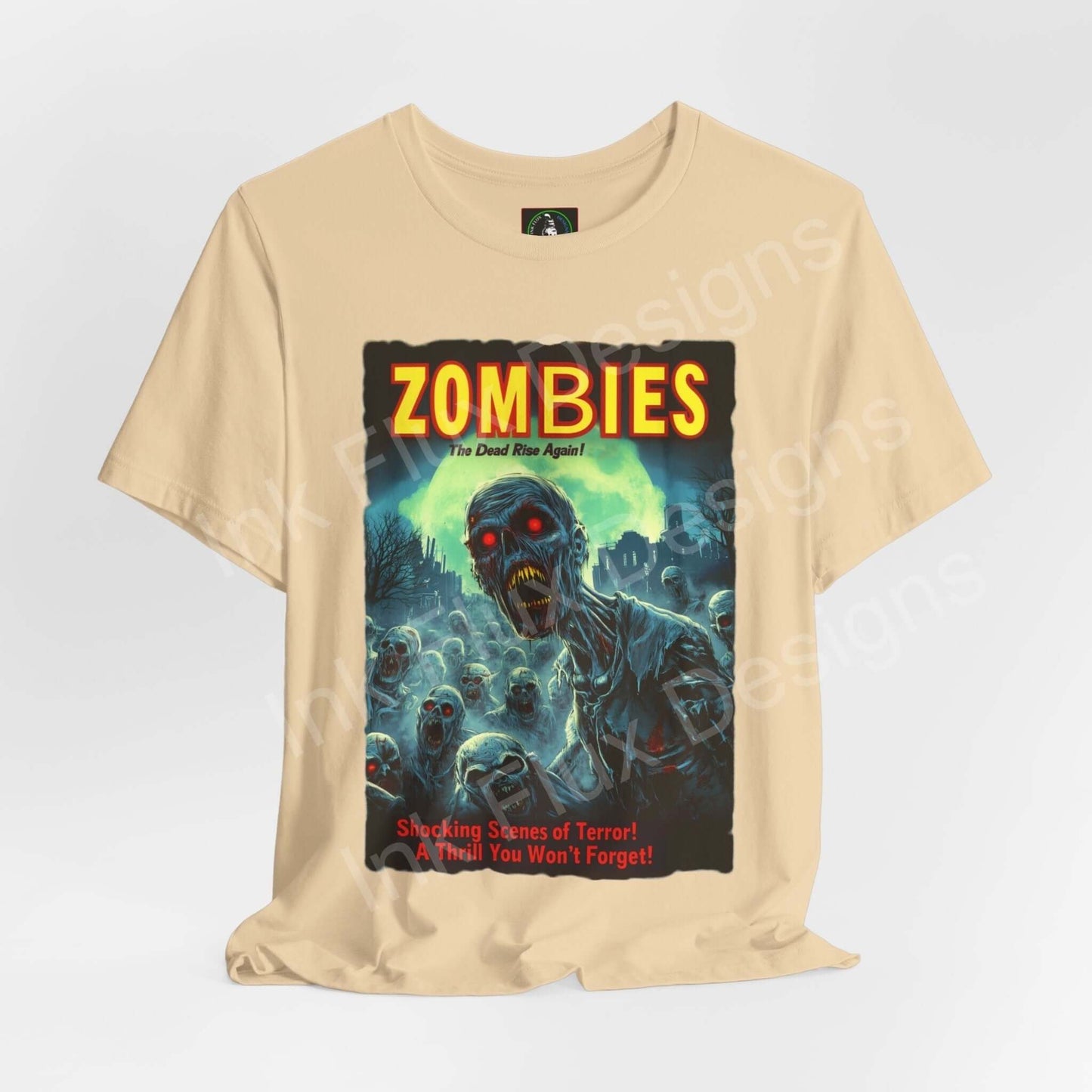 Halloween-themed 'Zombies! The Dead Rise Again' graphic tee, featuring vibrant zombie artwork on a unisex, beige cotton shirt.