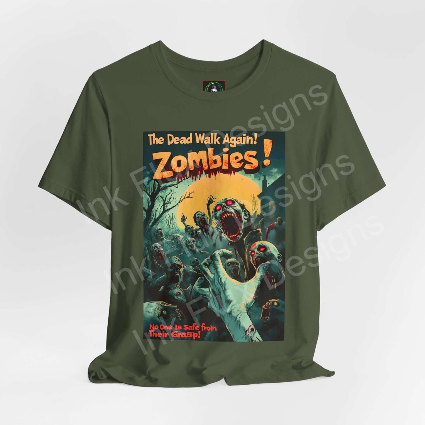 Halloween-themed graphic tee featuring 'Zombies! The Dead Walk Again!' design on a green Bella+Canvas unisex T-shirt.