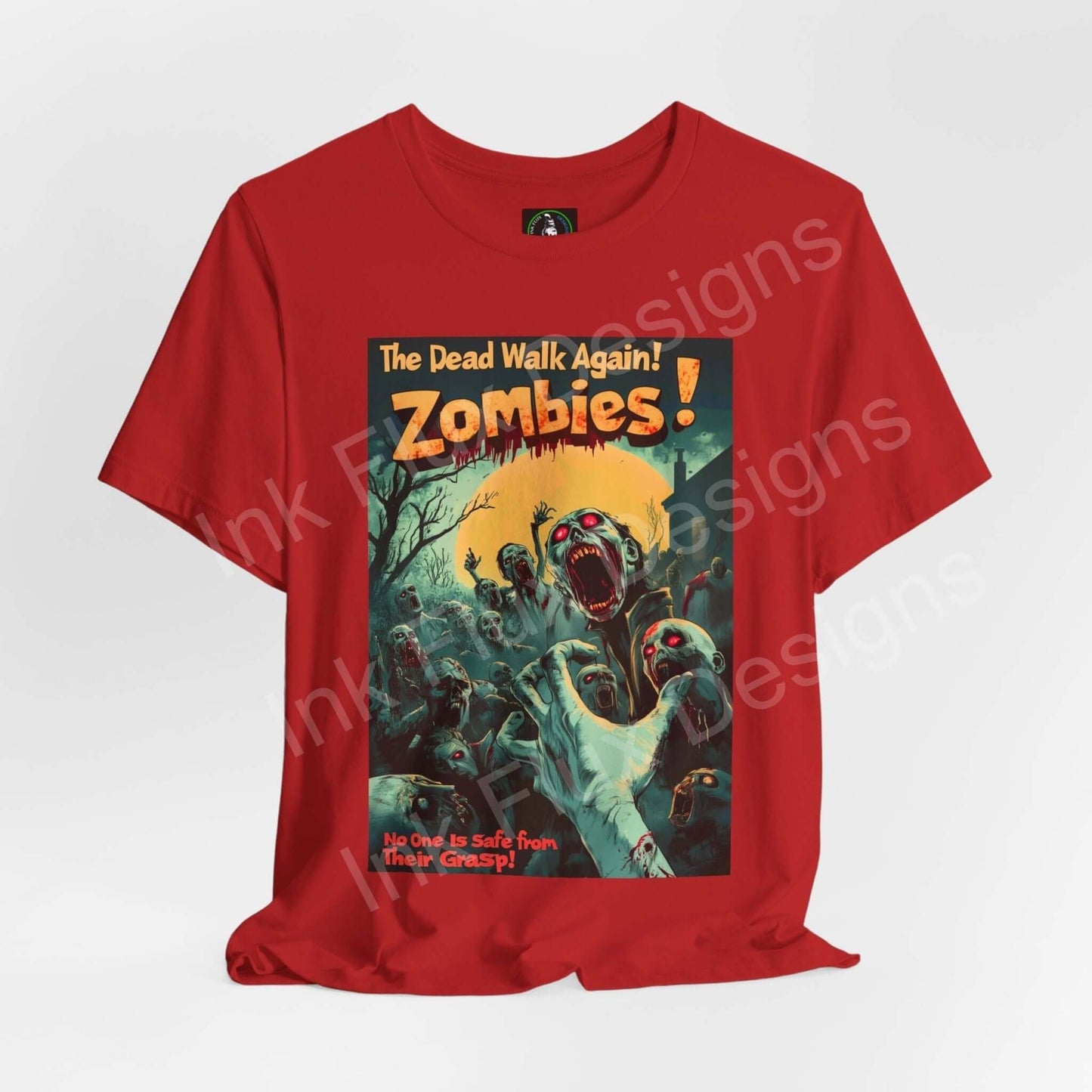Red Halloween-themed graphic tee with a vibrant 'Zombies! The Dead Walk Again!' design, featuring multiple zombies emerging aggressively, perfect for spooky style enthusiasts.