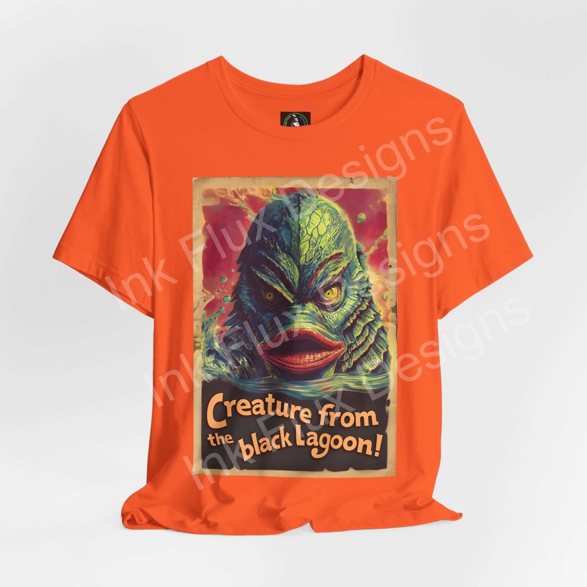 Creature From the Black Lagoon t-shirt featuring vibrant graphic design on orange fabric by Ink Flux Designs.