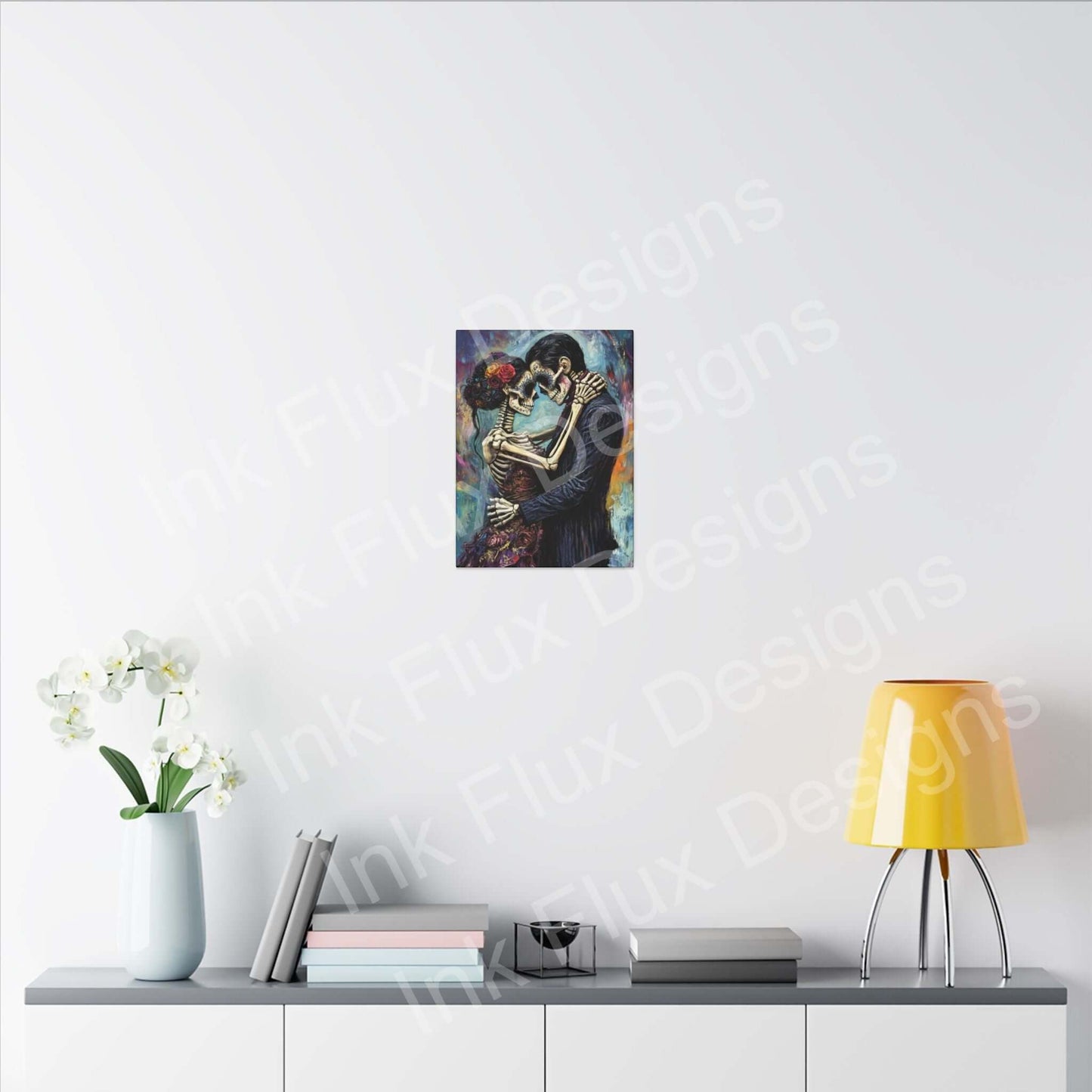 Day of the Dead couple portrait on matte canvas, displayed in a modern living space by Ink Flux Designs.