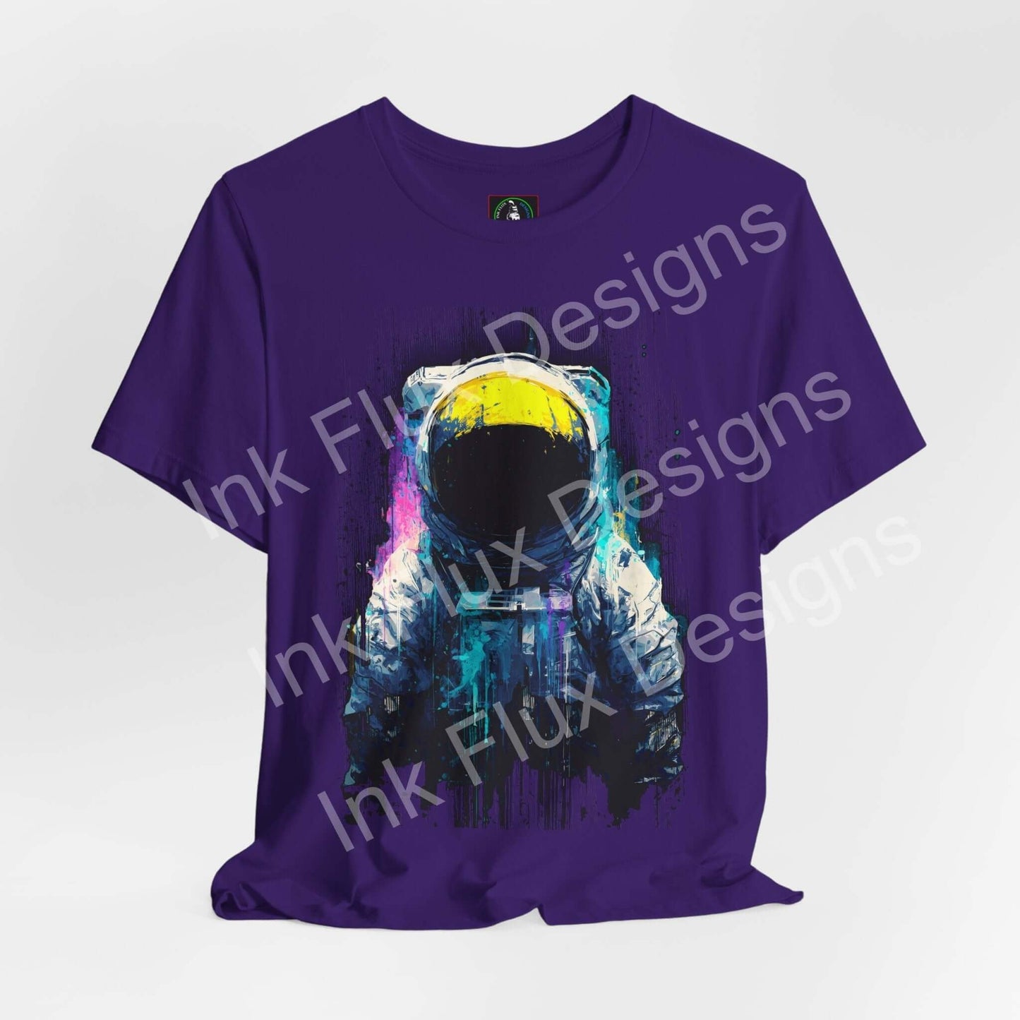 Graphic T-Shirt featuring a surreal astronaut design in vibrant colors on a purple background.