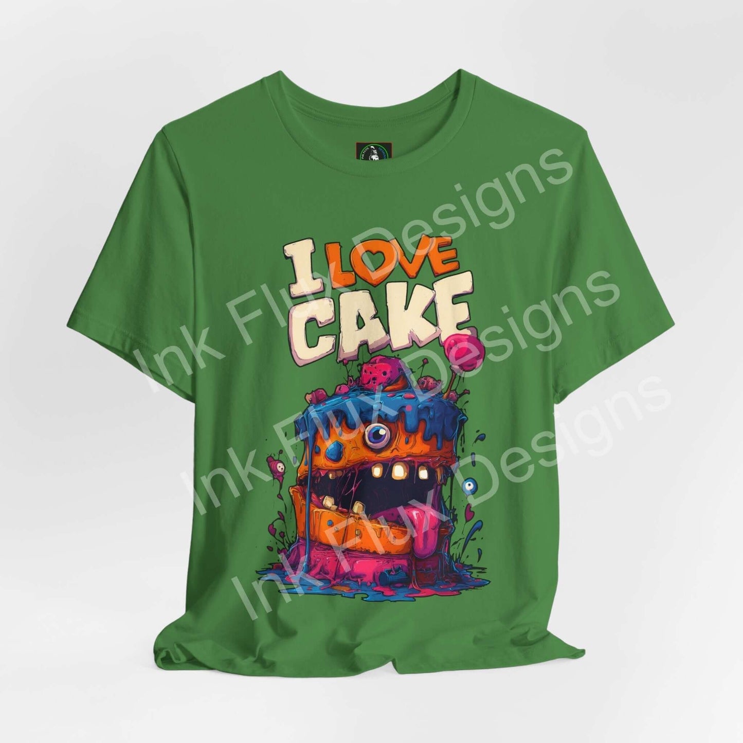 Funny Graphic T-Shirt featuring a colorful monster cake design with bold cartoon artwork.