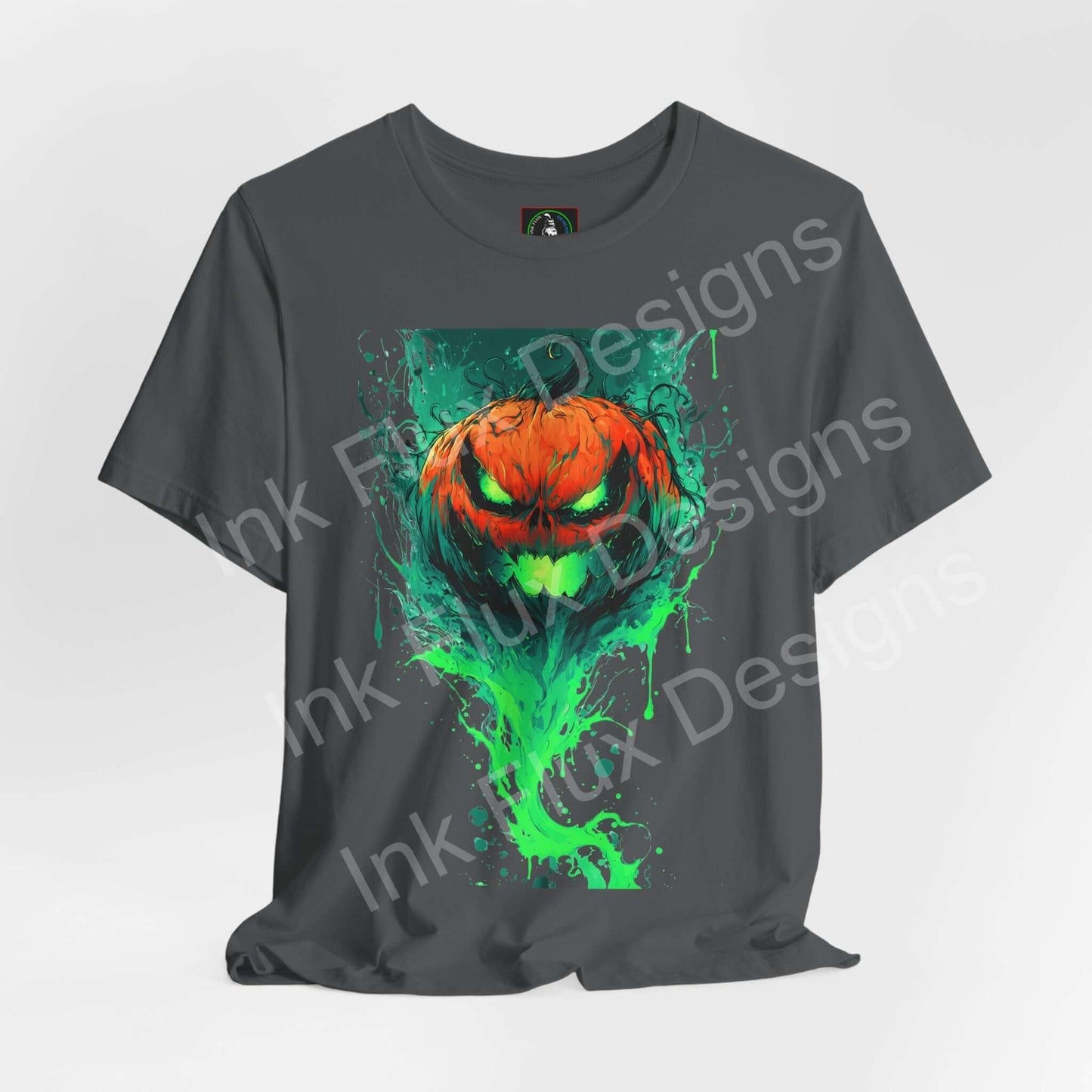 Ink Flux Jack o Lantern 2025 04 graphic t-shirt featuring a vibrant pumpkin design in green and orange.