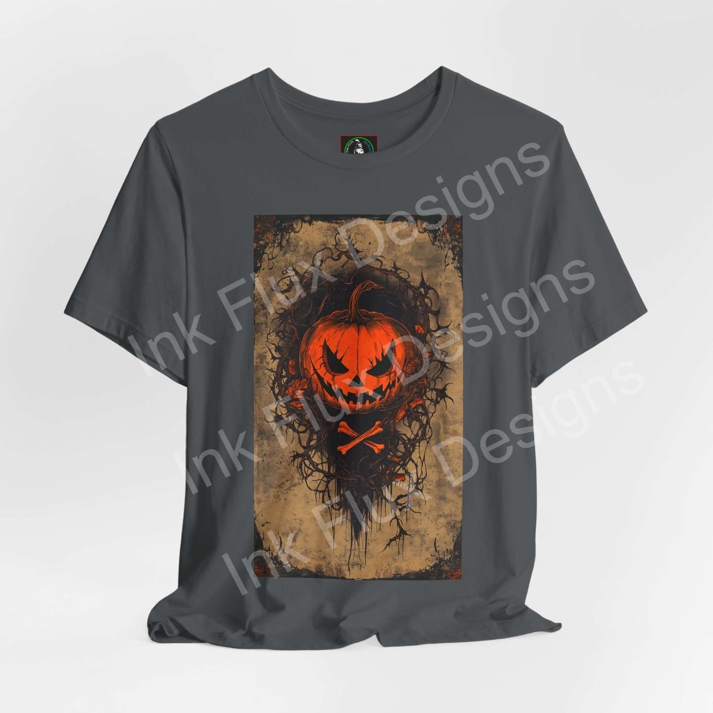 jack-o-lantern t-shirt featuring a glowing pumpkin face on a dark gray background by Ink Flux Designs