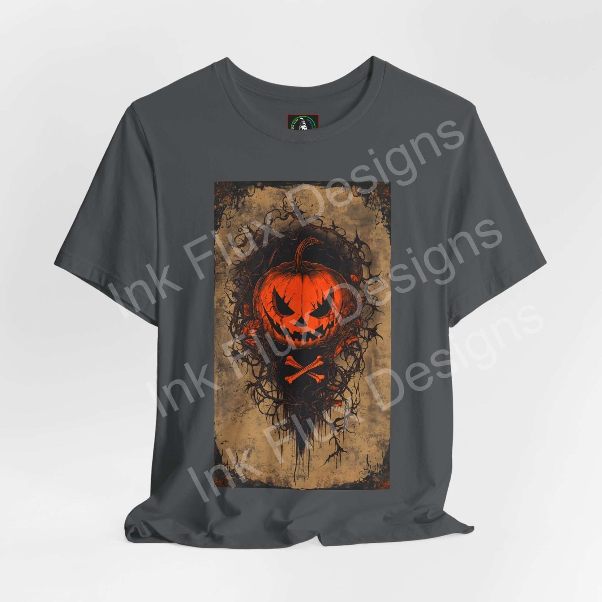 jack-o-lantern t-shirt featuring a glowing pumpkin face on a dark gray background by Ink Flux Designs