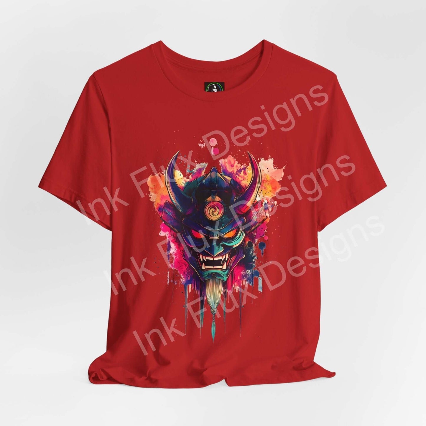 Vibrant Oni Mask design on a red T-shirt by Ink Flux Designs, showcasing a bold, artistic print.
