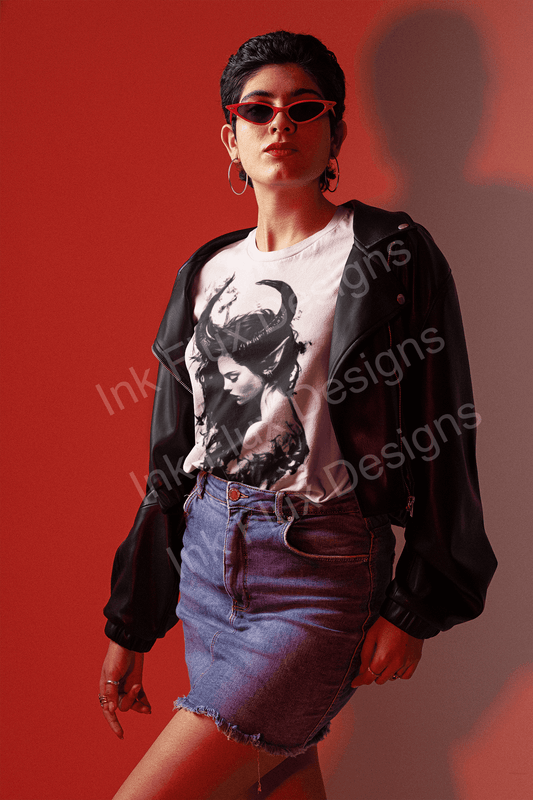 Stylish woman posing in a Succubus T-shirt with a denim skirt and black jacket against a red background