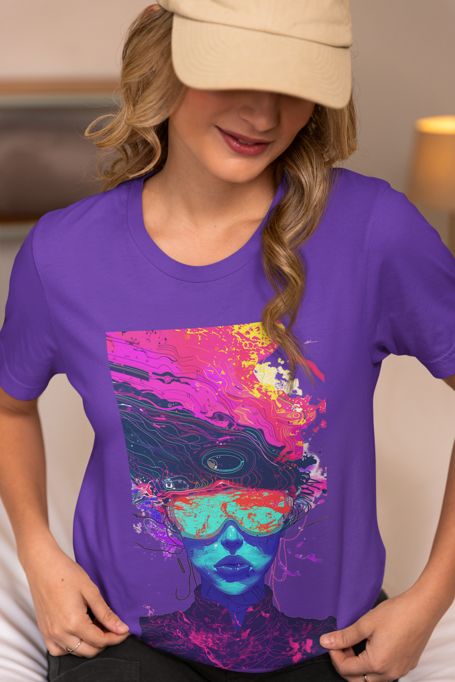 Woman in purple psychedelic t-shirt with vibrant, colorful abstract face design, wearing a cream cap.