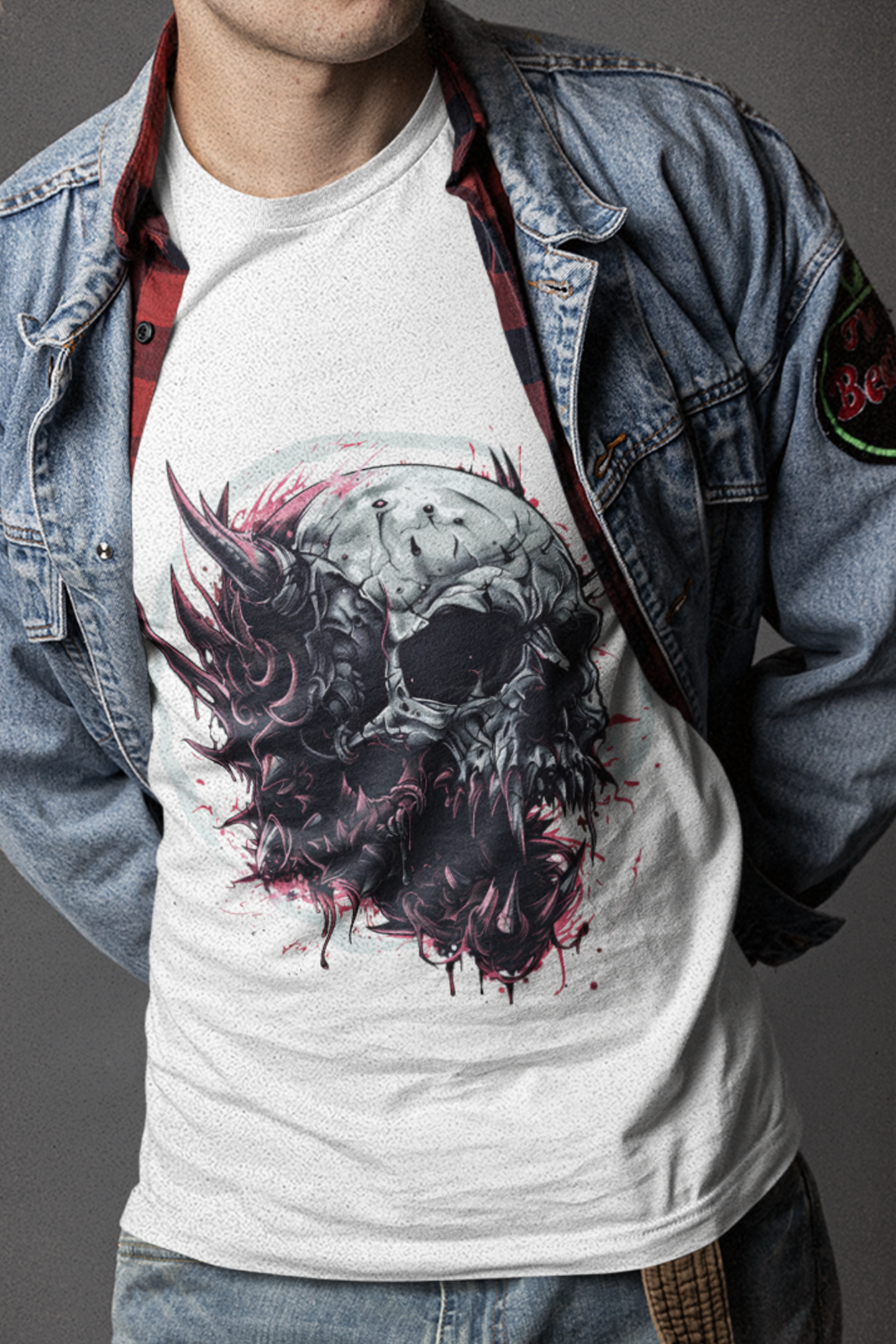 Man wearing a skull and tentacle design t-shirt from the Skulls, Bones T-shirts collection, styled with a denim jacket.