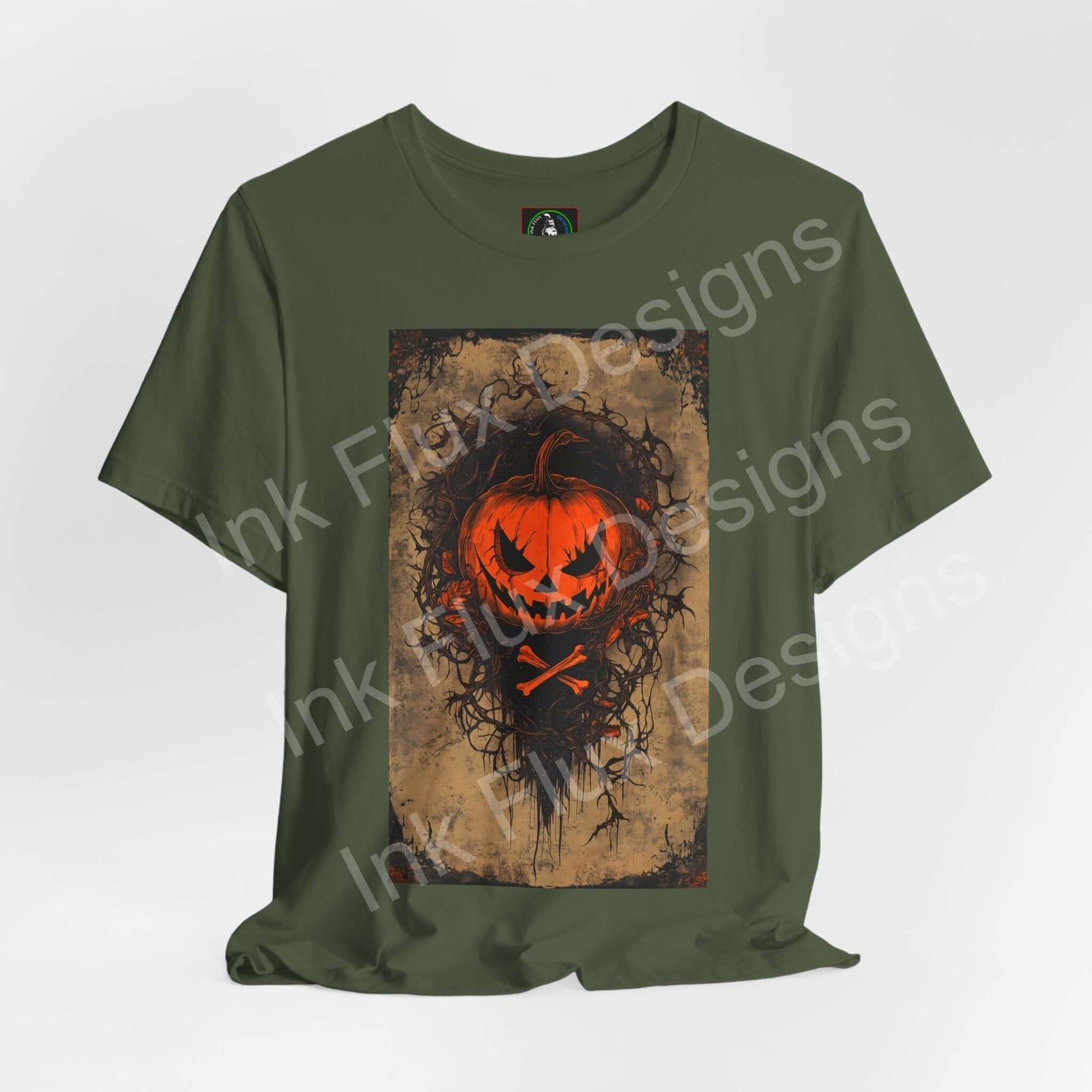 jack-o-lantern t-shirt featuring a bold pumpkin design on a green unisex tee by Ink Flux Designs.