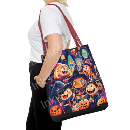 Woman carrying a Little Witches Tote Bag featuring colorful all-over print of cartoon witches and pumpkins, with red straps.
