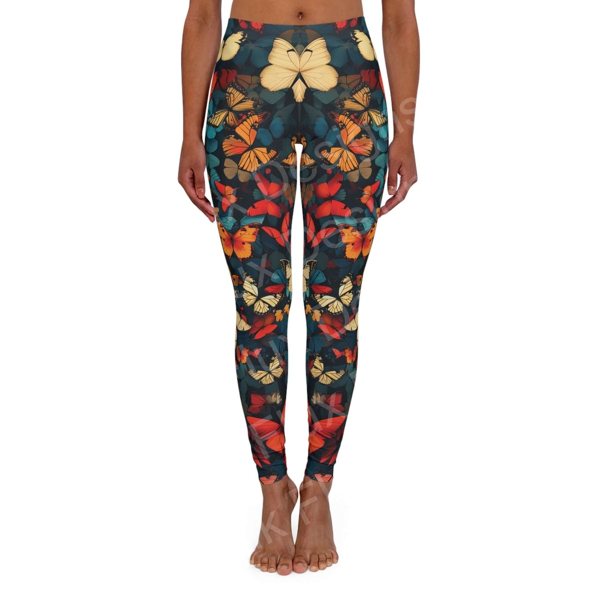 Woman wearing butterfly leggings with a colorful array of bold designs, showing front view standing pose, ideal for athleisure and workouts.