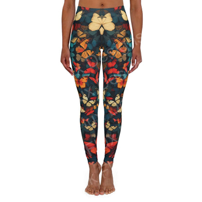 Woman wearing butterfly leggings with a colorful array of bold designs, showing front view standing pose, ideal for athleisure and workouts.