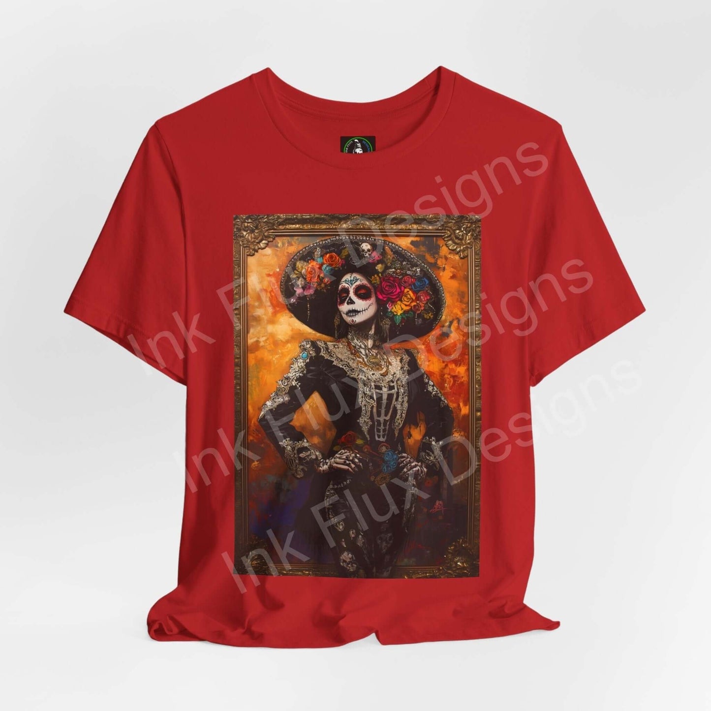 Red Day of the Dead T-shirt featuring a graphic of a Charro Woman in traditional DÃ­a de Muertos makeup and attire, by Bella+Canvas.