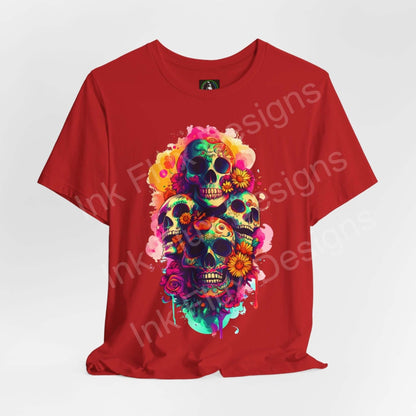 Vibrant Day of the Dead graphic tee featuring a colorful skull design with floral accents on a red T-shirt, perfect for DÃ­a de Muertos celebrations.