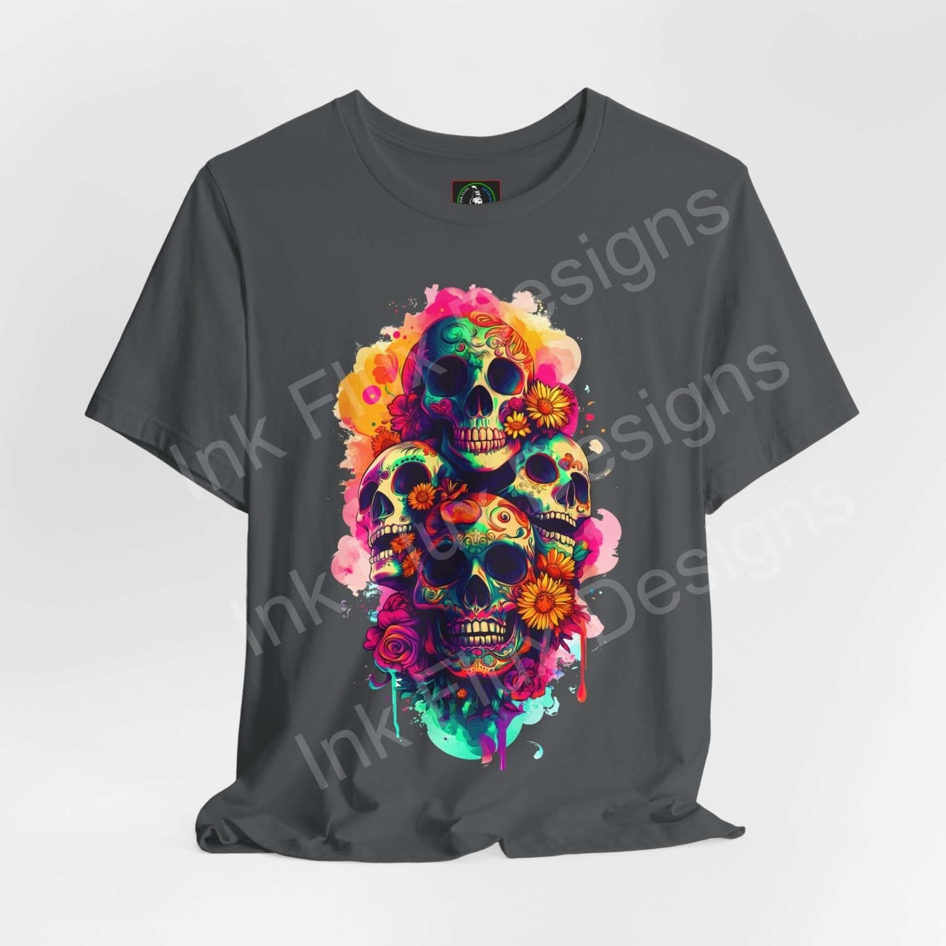Unisex gray T-shirt featuring a vibrant Day of the Dead skull graphic, adorned with colorful floral patterns, perfect for DÃ­a de Muertos celebrations.