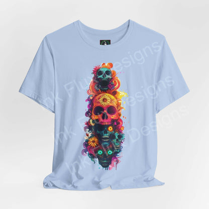 Light blue unisex T-shirt featuring colorful Day of the Dead skulls design, ideal for DÃ­a de Muertos themed graphic tees.