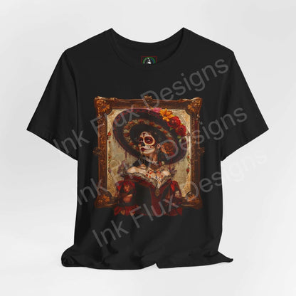 Black T-shirt featuring Day of the Dead graphic tee design with vibrant Dia de Muertos skeleton artwork in ornate frame.