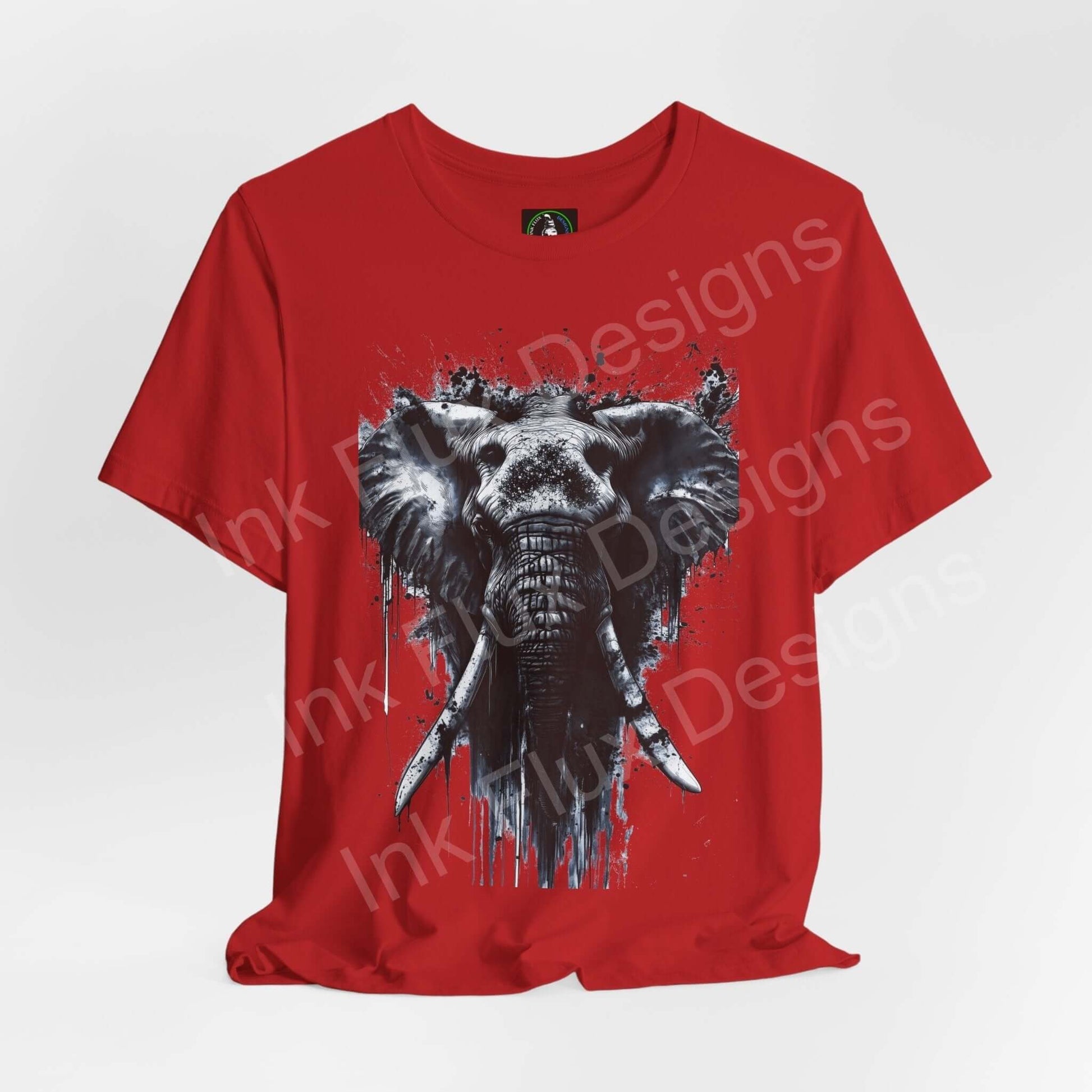 Red unisex T-shirt featuring a graphic of a white elephant spirit animal design, from the 'Elephant Spirit II' collection by Bella+Canvas.