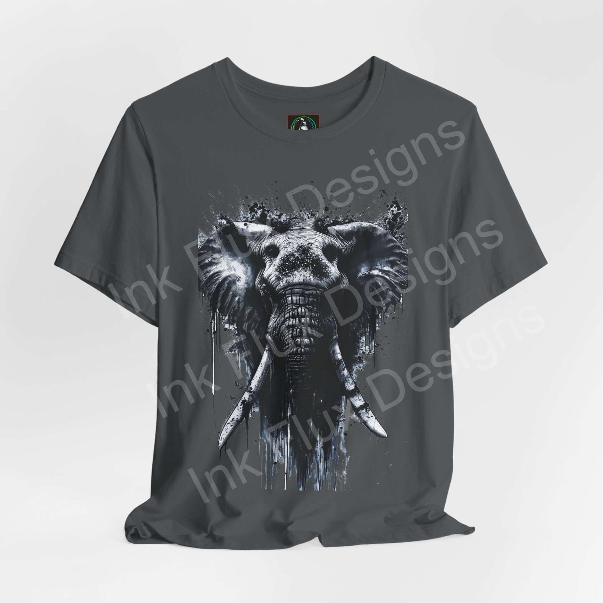 Graphic Tee featuring a bold elephant design in a splatter art style on a gray unisex shirt, capturing the essence of spirit animals.
