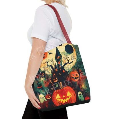 Woman carrying a Halloween-themed tote bag featuring vibrant all-over print of haunted house and pumpkins.