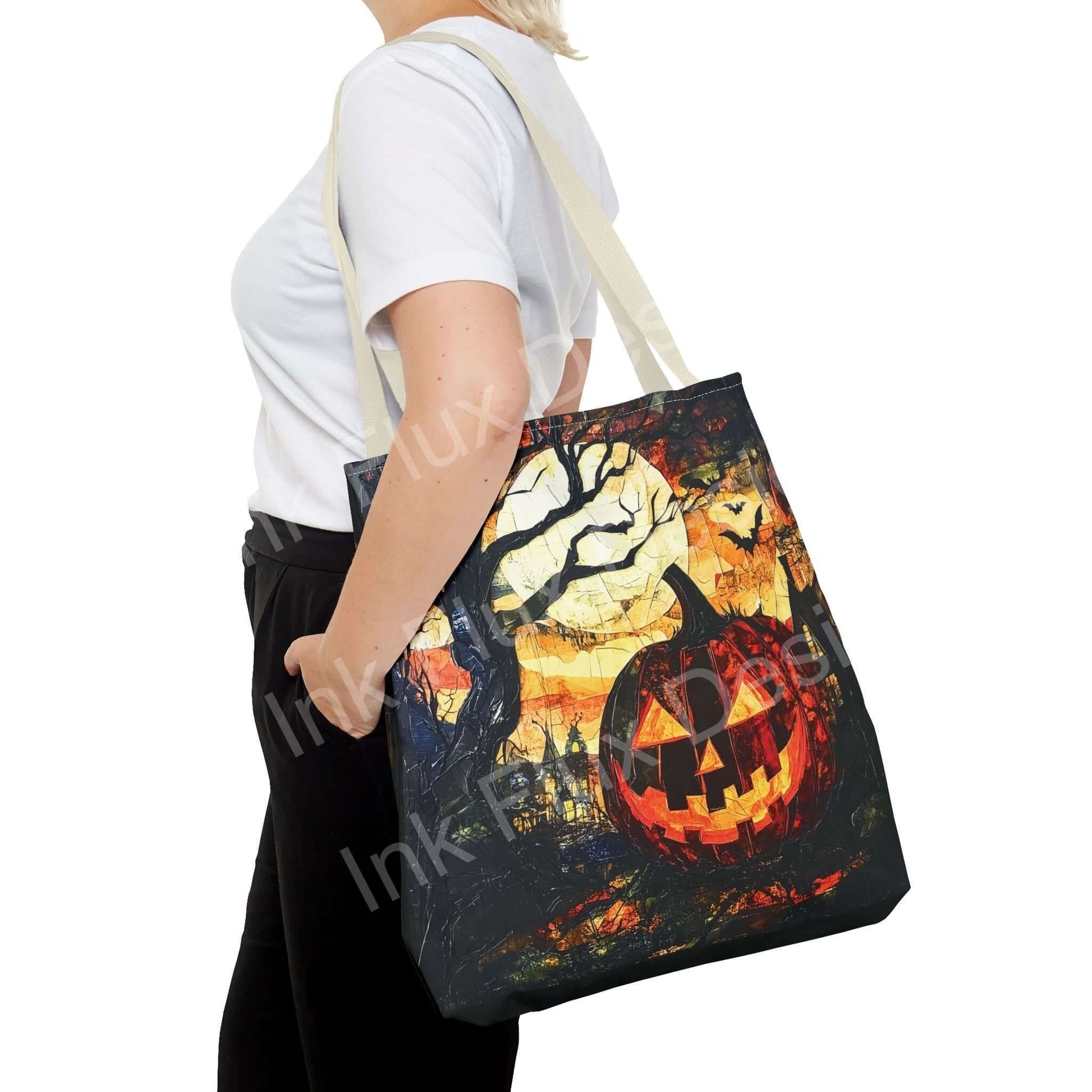 Woman carrying a Jack o Lantern painting tote bag with a dramatic Halloween-themed design, featuring vibrant colors and durable straps.