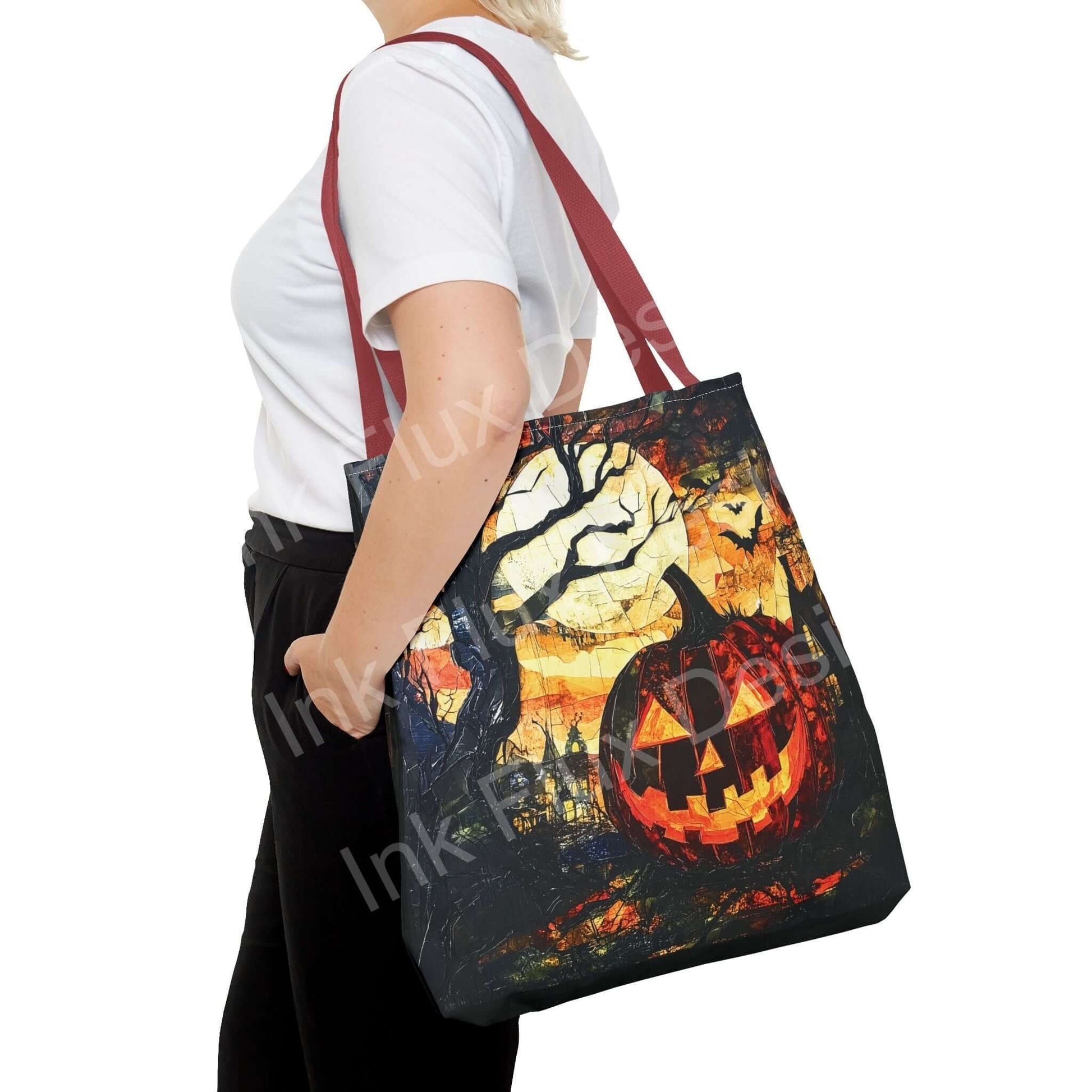 Woman carrying a Jack o Lantern painting tote bag with red handles, showcasing an all-over spooky design, ideal for Halloween-themed accessories.